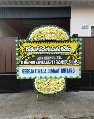 Papan Bunga Duka di Idi Tunong